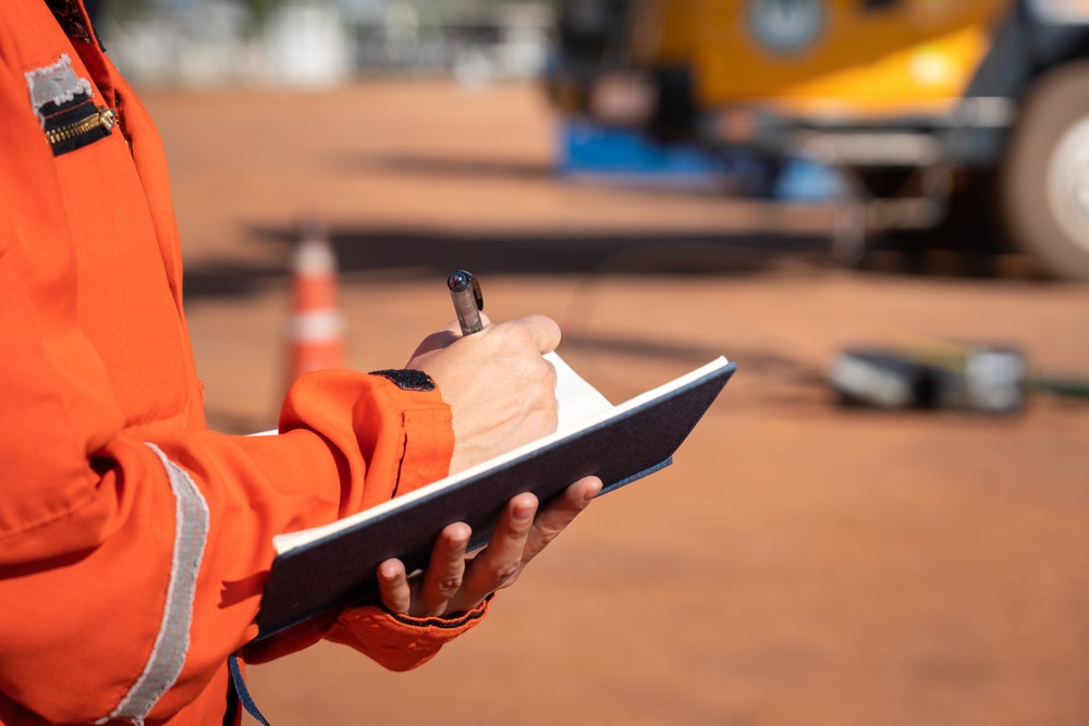 Investigator making notes about a truck accident